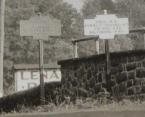 Photo likely from 1930s, also shows a keystone used as a directional marker