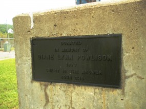 Plaque found on concrete block where marker post is mounted